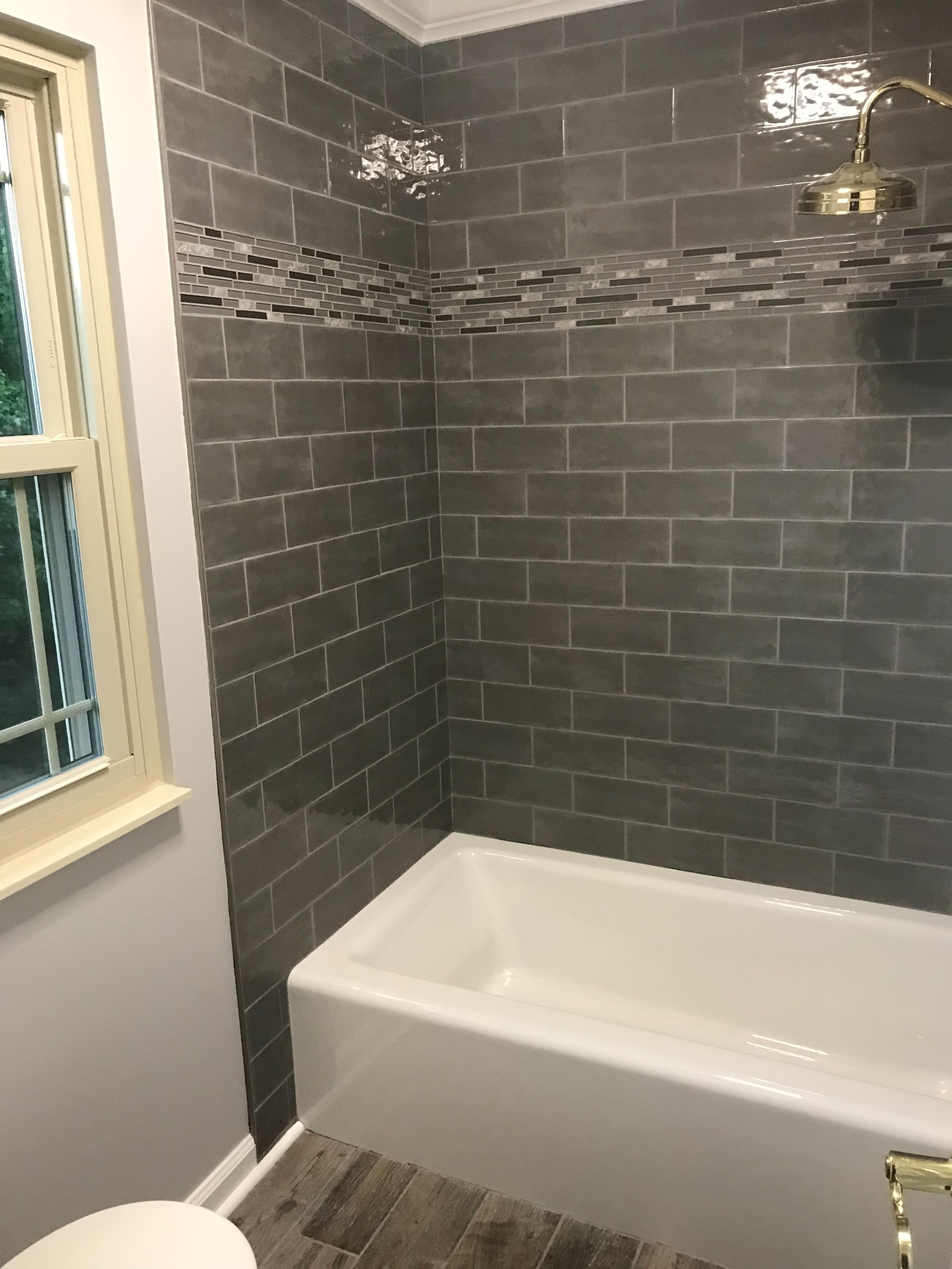 Small bathtub with shower